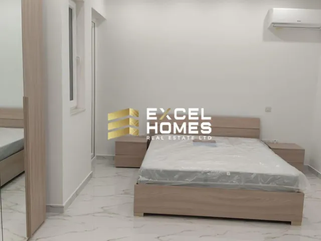 a bed room with a bed and a desk