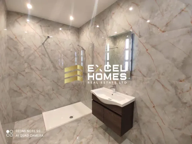 a bathroom with a sink, mirror, and bathtub