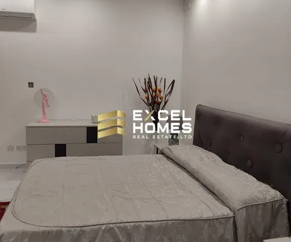 a bed with a lamp and a lamp post
