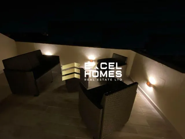 a dark room with a dark wall and a lighted ceiling