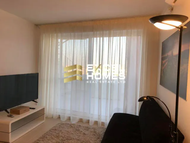 a bathroom with a window and a lamp