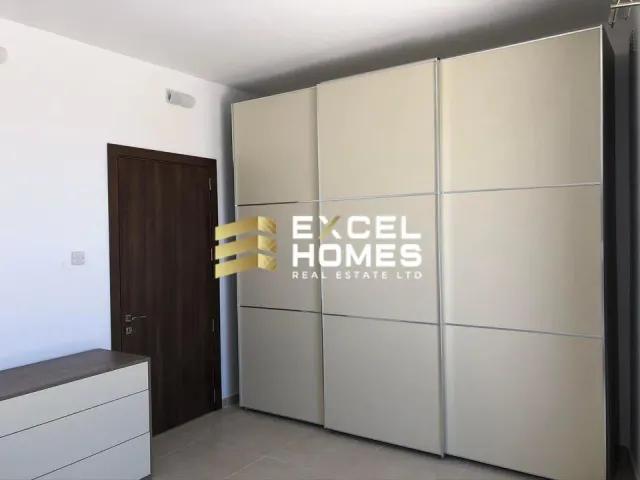 a bathroom with a mirror and a shelf with a picture of a woman