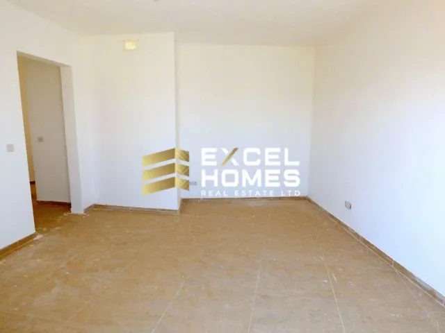 a bathroom with a toilet and a wall