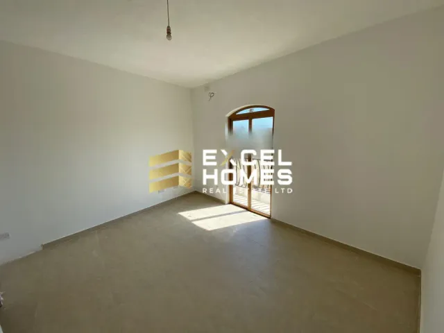 a room with a door open and a wall with a window