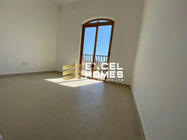 a room with a white toilet and a window