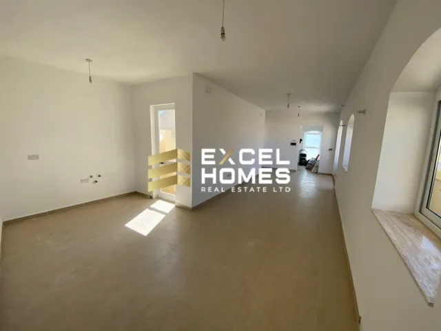 a bathroom with a toilet and a wall with a picture of a man in a wheelchair