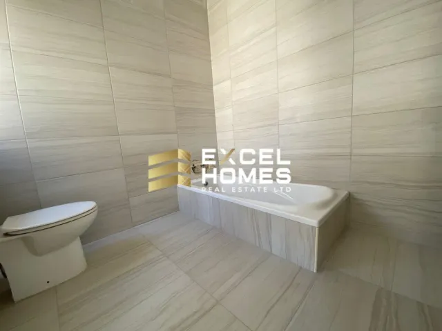 a bathroom with a toilet, sink, and bathtub