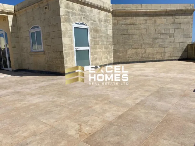 a building with a blue door and a white building