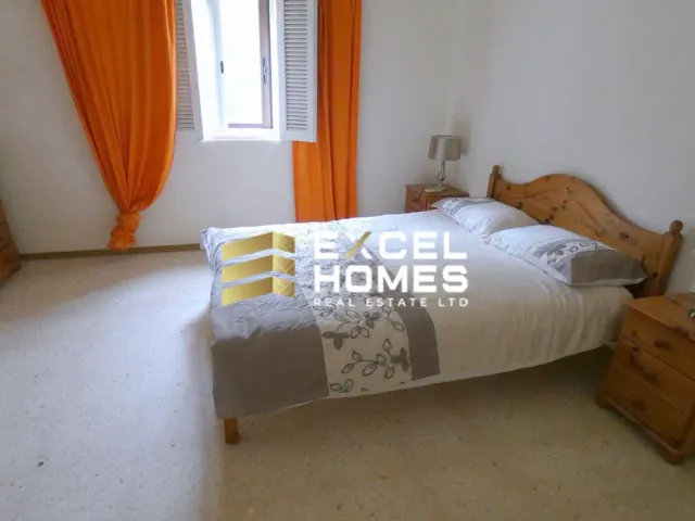 a bed with a white bedspread and a white bedspread