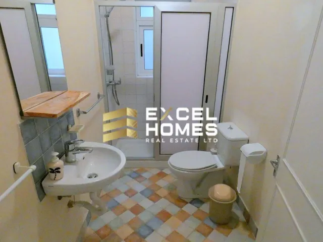 a bathroom with a toilet and a sink