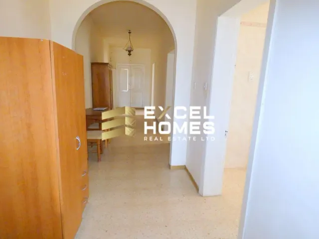 a room with a door leading to a hallway