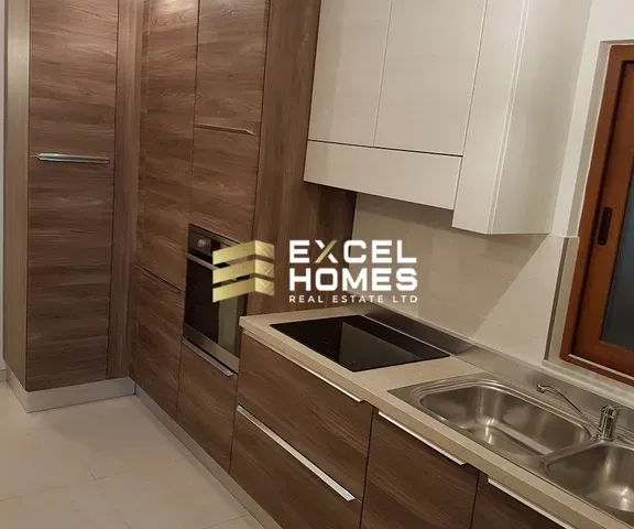 a kitchen with a sink, stove, and refrigerator 