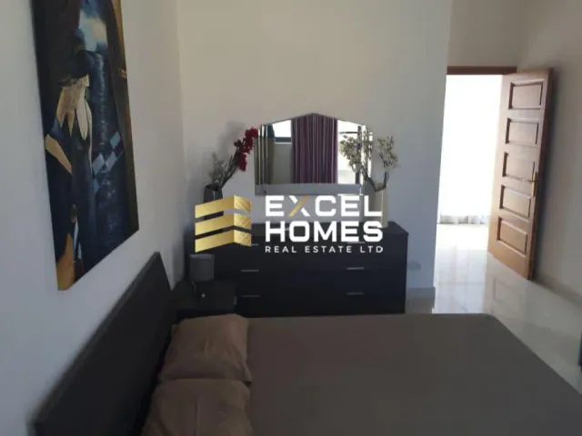 a living room with a couch and a television