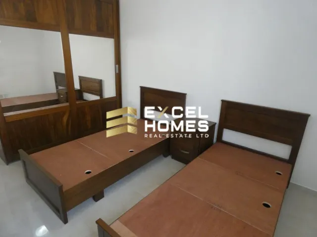 a bed room with a bed and a desk 