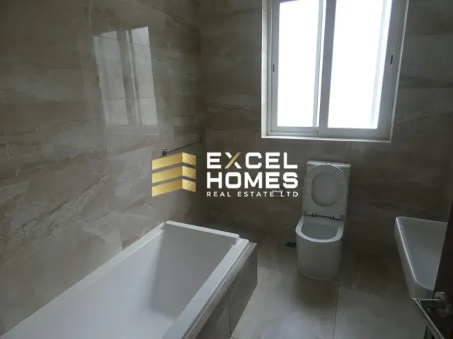 a bathroom with a tub, toilet and sink 