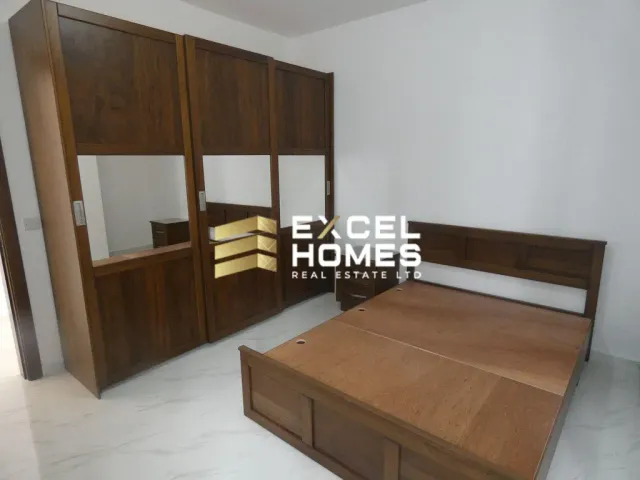 a bed room with a bed and a desk 