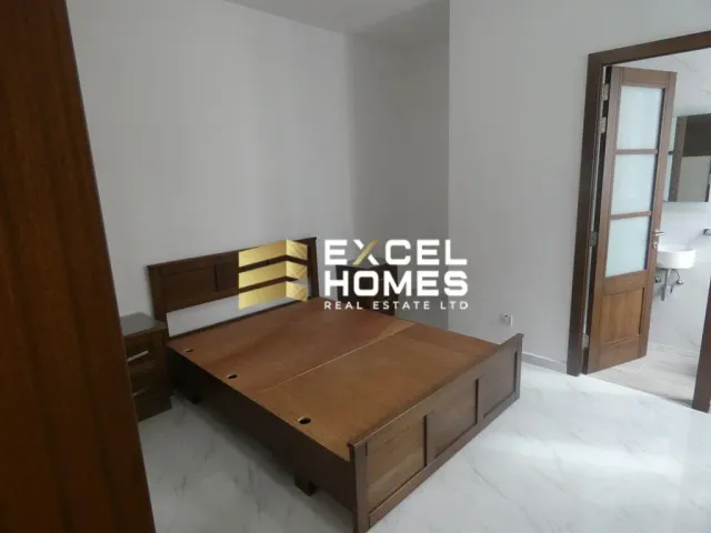 a bed room with a bed and a mirror 