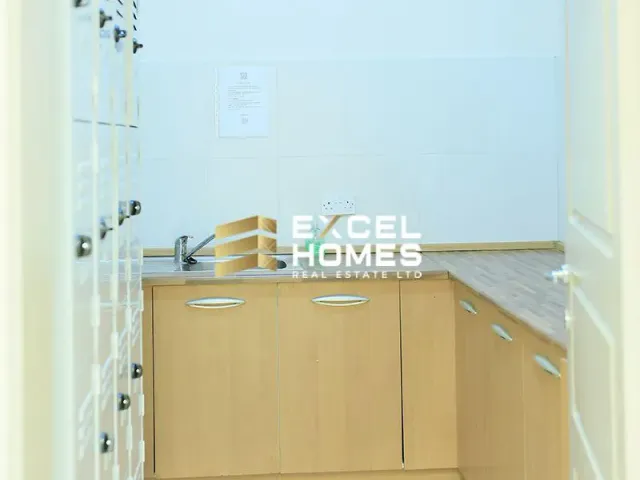 a kitchen with a sink and a refrigerator