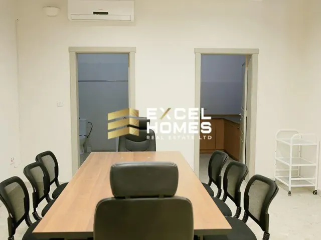 a room with a table and chairs and a table with a chair