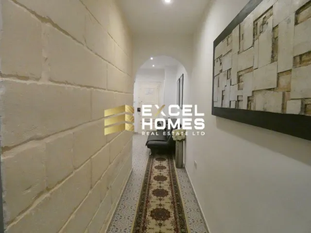 a wall with a rug and a wall with a rug