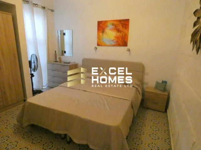 a bed room with a bed and a desk