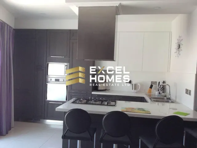 a kitchen with a table and a sink