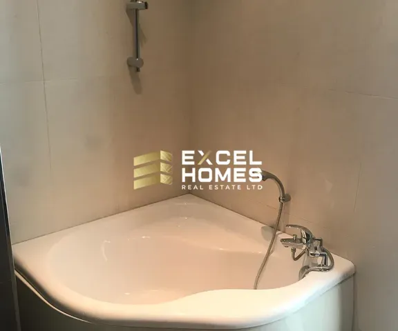 a bathroom sink with a toilet and a mirror