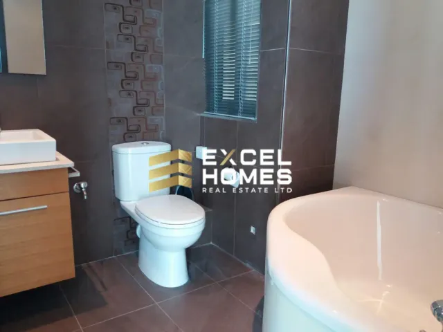 a bathroom with a toilet, sink, and bathtub