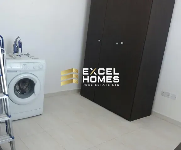 a white refrigerator with a black door