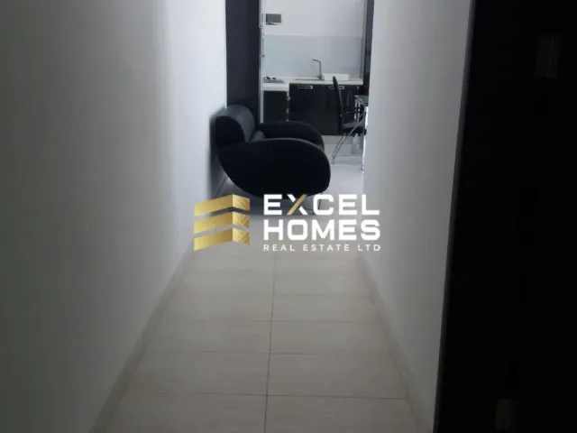 a black and white photo of a person sitting on a chair