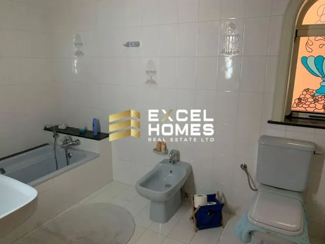 a bathroom with a toilet, sink, and bathtub