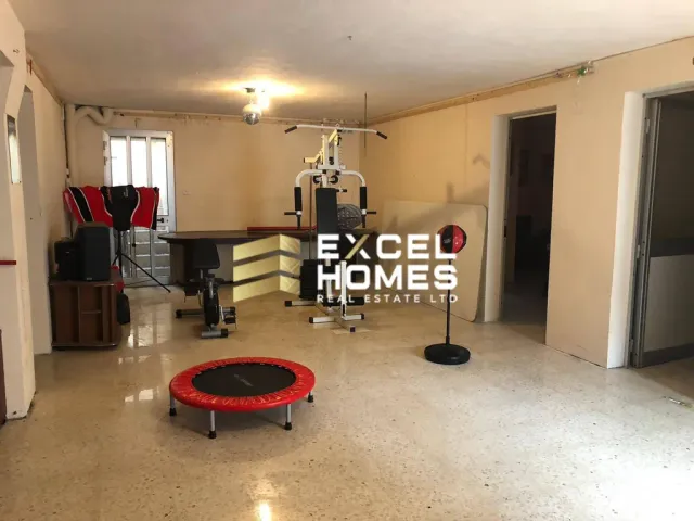 a living room with a couch, chair, and a table
