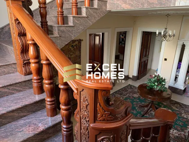 a staircase leading to a stair case with a dog on it