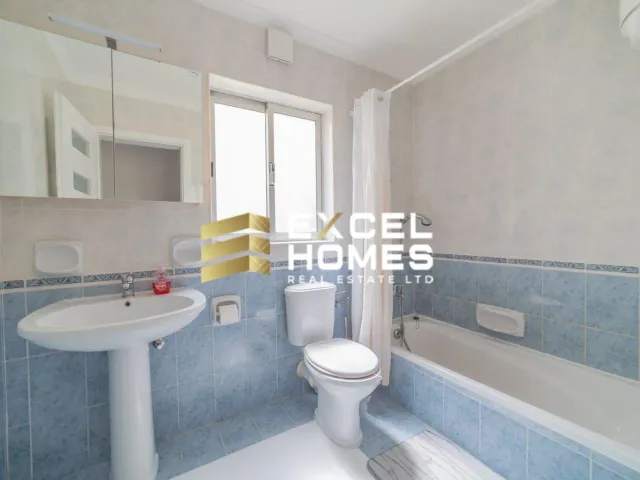 a bathroom with a toilet, sink, and bathtub