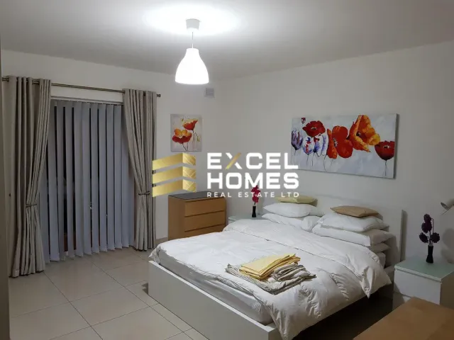 a bedroom with a bed, a lamp, and a wall mounted wall mounted wall mounted wall mounted wall mounted wall mounted wall mounted wall mounted wall mounted wall mounted wall mounted wall mounted wall mounted wall mounted wall mounted wall mounted wall mounted wall mounted wall mounted wall