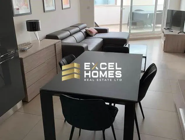 a living room with a couch and a table