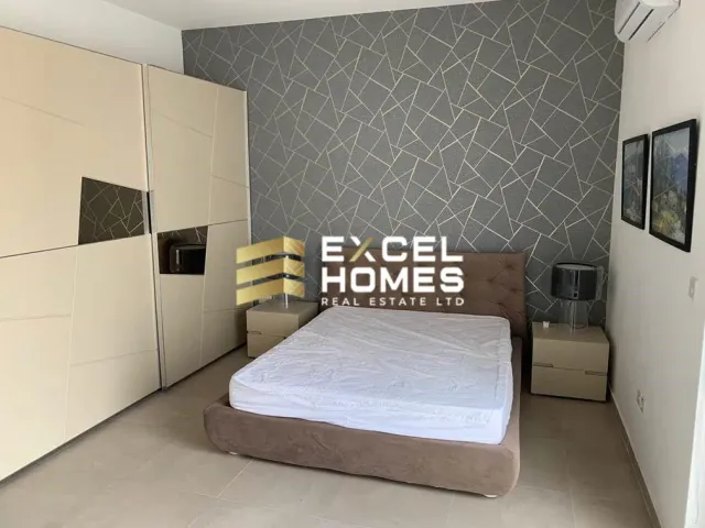 a bed room with a bed and a desk