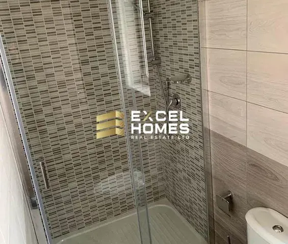 a bathroom with a mirror and a bath tub