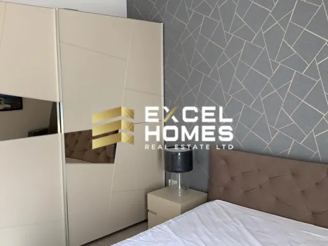 a bed with a white bedspread and a white bedspread