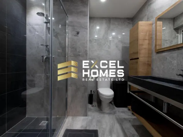 a bathroom with a toilet, sink, and bathtub