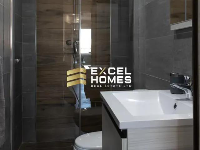 a bathroom with a sink, mirror, and toilet