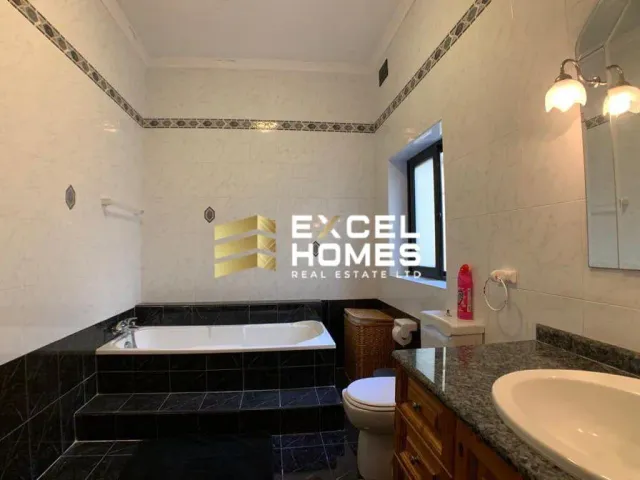 a bathroom with a toilet, sink, and bathtub