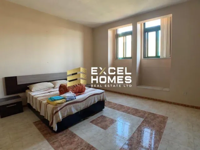 a bed with a blanket and a pillow on it