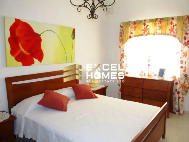 a bed with a white bedspread and a white bedspread