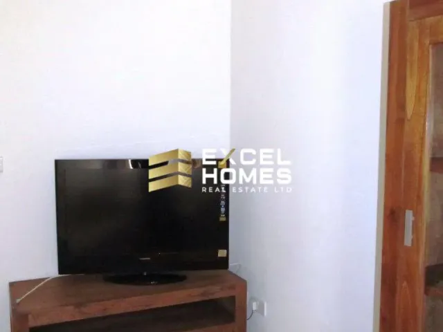 a television set sitting on top of a wooden stand
