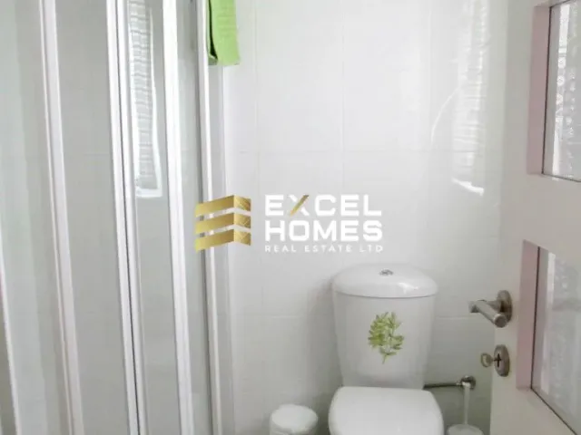 a bathroom with a toilet and a sink