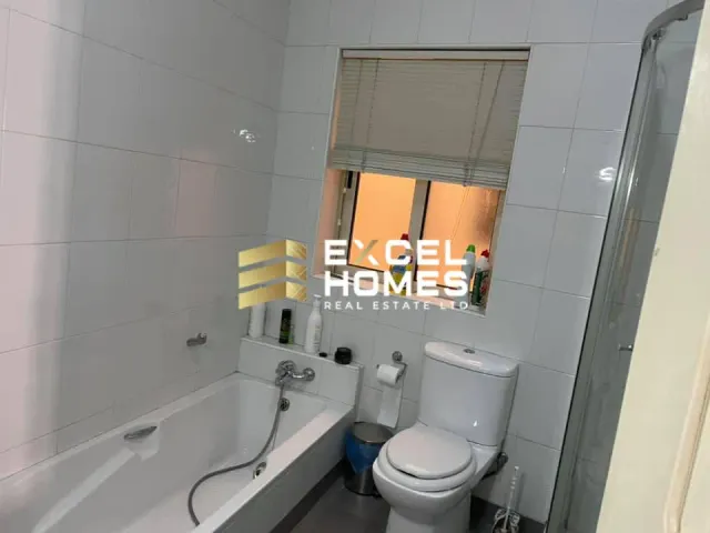 a bathroom with a toilet and a sink 