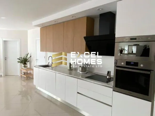 a kitchen with a stove, microwave, and refrigerator