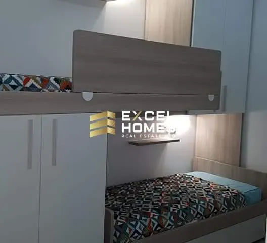 a kitchen with a bed and a stove