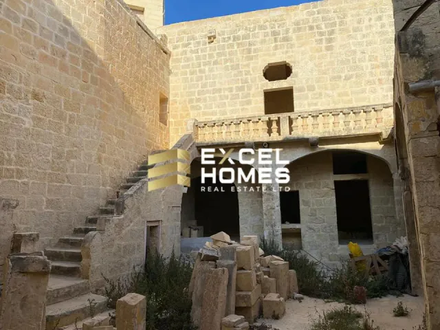 a building with a sign that says "the door is open"